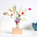 Wooden holder with dried flowers pink
