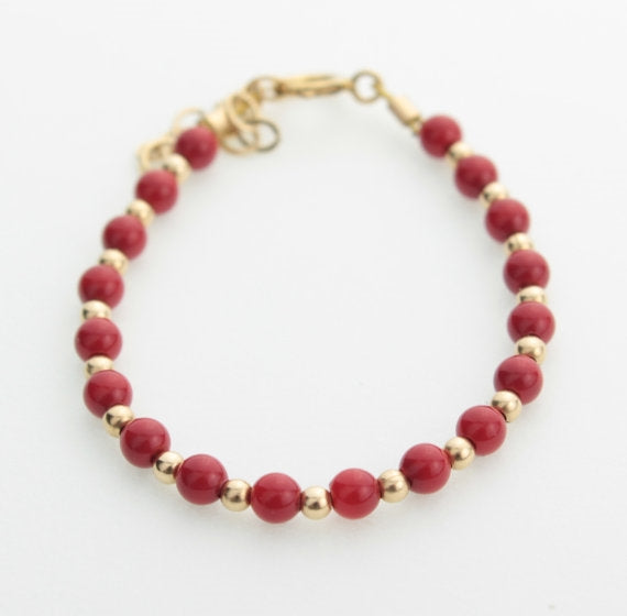 Red Bracelet with Gold Beads