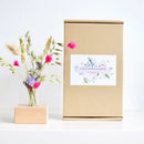 Wooden holder with dried flowers pink